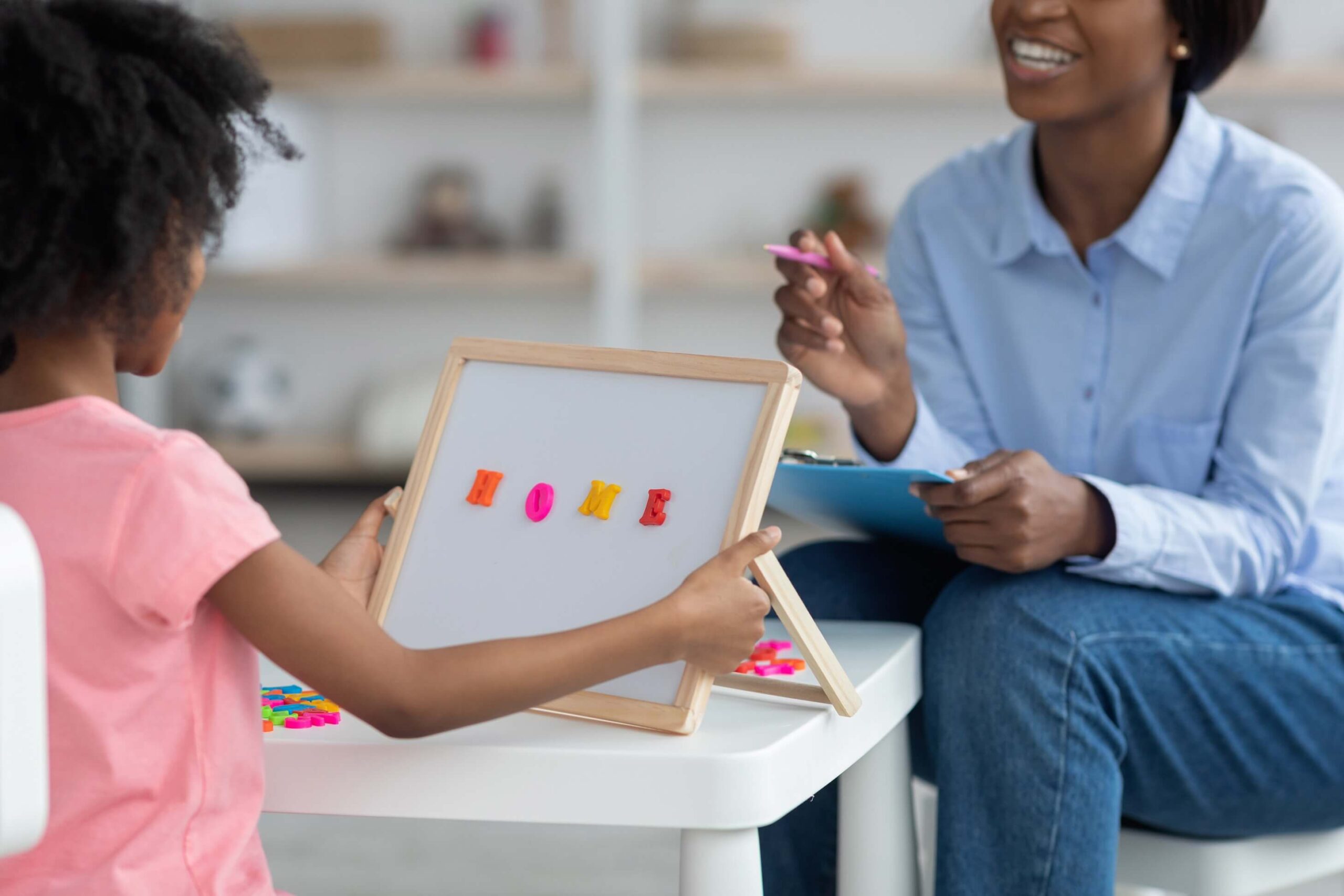 ABA therapy technique with therapist using prompts during activity.